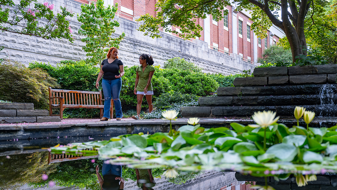 uncg campus and the view of a pond